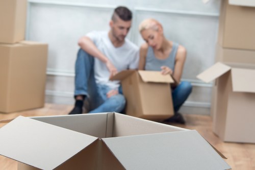Packed storage unit with labeled boxes and household items