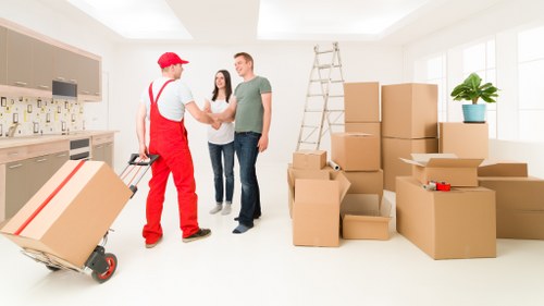 Protected sofas and tables stored safely in a Sydenham storage facility